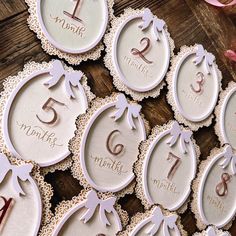 twelve handmade wooden tags with the numbers fifteen, twenty and five on them sitting on a table