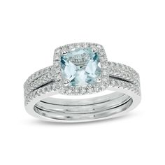 an aqua blue topazte and diamond ring set