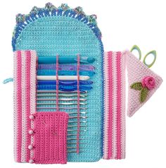 a crocheted purse with scissors and knitting needles in it on a white background