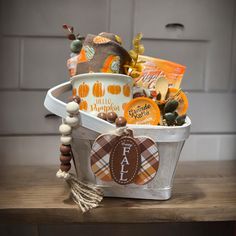 This cozy, fall- themed home gift basket could be perfect for someone who just closed on a new home or bring it as a Thanksgiving host gift. It includes warm fall colors like rusty orange and burgundy. This gift basket includes:  * a reusable small chip  basket  * "Hello Pumpkin" coffee mug  * "Happy Fall" small sign decor  * 2 pairs of Fall Themed Socks * 2 packets of Spice Apple Cider * 2 Pumpkin Latte Coffee Pods *  Small petite wood spoon This fall gift basket will come wrapped in tulle/ shr Spice Apple Cider, Hostess Basket, Guest Welcome Baskets, Home Gift Basket, Chip Basket, Welcome Gift Basket, Thanksgiving Host Gift, Thanksgiving Host, Autumn Treats