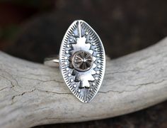 "This sterling silver bohemian concho ring is so funky and fun. Each ring is made to order from raw sterling silver sheet metal using hand-carved Navajo metal dies to forge the shapes into the silver and give it that unique southwestern style. The design is stamped into thick 18 gauge sterling silver sheet and fired onto a sturdy half-round sterling silver band. I then give it a darkened patina and highlight the relief for nice contrasts. Each ring is marked .925 for sterling silver. These are b Silver Bohemian Concho Rings, Bohemian Silver Concho Rings, Bohemian Stamped Silver Rings, Bohemian Silver Stamped Rings, Bohemian Oval Stamped Jewelry, Silver Boho Rings, Rings Sterling Silver, Stacking Bands, Southwestern Jewelry