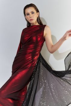 Metallic red bodyfit gown with cape sleeve on one side and a black sequined trail on the other side. - Aza Fashions Red Party Dress With Cape Sleeves, Fitted Gown With Cape Sleeves For Parties, Glamorous Asymmetrical Party Gown, Trail Gown, Foil Boat, Gown With Cape, Gown For Women, Red Gowns, Ladies Gown