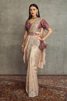 Beige silk saree with floral embroidered motifs and scallop border. Paired with floral embroidered blouse and embroidered belt.
Component: 3
Pattern: Embroidered
Type Of Work: Floral
Neckline: Sweetheart
Sleeve Type: Short Sleeves
Fabric: Silk
Color: Beige
Other Details: 
Back tassel tie-up
Floral motifs
Note: Bag shown in the image is not for sale
Occasion: Wedding, Bride - Aza Fashions Beige Silk Saree, Reception Saree For Bride, Elegant Fashion Outfits, Reception Saree, Jayanti Reddy, Saree With Belt, Bridal Sarees South Indian, Saree Draping Styles, Bridesmaid Saree