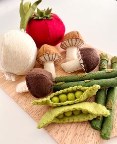 several vegetables are arranged on a cutting board