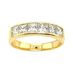 a yellow gold ring with princess cut diamonds