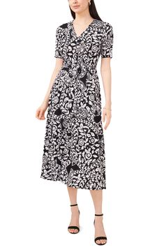 Dash off to your next brunch date in this pretty floral midi dress that's cinched at the waist with a sash-tie belt. 47 1/2" length (size Medium) V-neck Short sleeves Unlined 96% polyester, 4% spandex Machine wash, tumble dry Imported Belted V-neck Midi Dress For Garden Party, V-neck Belted Midi Dress For Garden Party, Belted Knee-length Midi Dress For Garden Party, Elegant Midi Dress With Tie Waist For Garden Party, Chic Belted Maxi Dress For Garden Party, Black Midi-length Belted Dress For Spring, Black Midi Length Belted Dress For Spring, Black Belted Midi Dress For Spring, Chic Mid-length Maxi Dress With Tie Waist