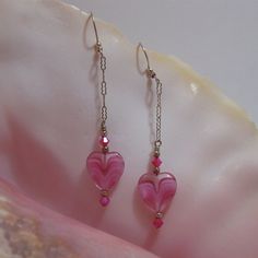 "These beautiful pink earrings are made using pink & clear glass heart beads with hot pink colored Swarovski Crystal bicones and sterling silver spacer beads.  The unique chain is also sterling silver as well as the longer ear wires.  The earrings measure 3\" in length from the top of the ear wire." Cheap Valentines Day Gifts, Beaded Chandelier Earrings, Earring Making, Valentine Ideas, Crystal Dangle Earrings, Wine Glass Charms, Heart Drop Earrings, Dream Girl, Pink Beads