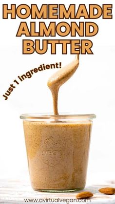 homemade almond butter being poured into a jar