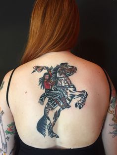 a woman with a tattoo on her back