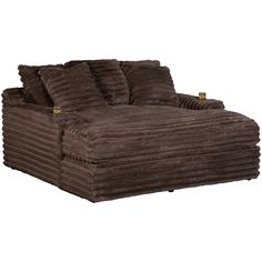 a large brown couch sitting on top of a white floor