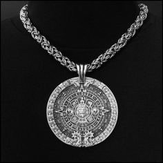 This piece features my huge 3" (76mm) Aztec Calendar Stone design pendant. It includes a thick 9mm polished round chainmaille necklace. It will catch every eye within a 50 feet and be the source of many conversations. The look and feel of our necklace upon the first touch will speak to you immediately of hand-crafted quality. It makes a stunning accessory - appropriate for all ages, men or women - all will love it. It includes a black velvet jewelry pouch, my signed certificate of authenticity a Spiritual Style Silver Medallion Necklace With Large Pendant, Festival Jewelry Large Medallion Pendant, Engraved Metal Medallion Chain Necklace, Engraved Metal Round Pendant Chain Necklace, Engraved Medallion Metal Chain Necklace, Spiritual Oxidized Medallion Jewelry, Oxidized Stainless Steel Medallion Necklace, Spiritual Sterling Silver Medallion Necklace, Tarnish Resistant, Aztec Jewelry