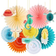 colorful paper fans with sea creatures hanging from them