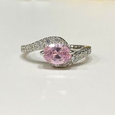 Vintage Sterling Silver Pink Sapphire & White Topaz Ring ...Marked 925...Total of weights 1.7gramsMeasure of Stone center 7 x 5MM...Measure of Face 7.5MM....It's in very good condition. Topaz Ring, White Topaz, Pink Sapphire, Solitaire Ring, Sterling Silber, Vintage Sterling Silver, Beauty Book, Topaz, Accessory Gift