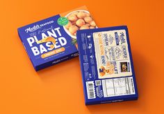 two packages of plant based snacks on an orange background