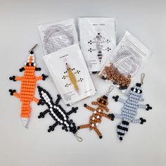 beaded animal keychains in various colors and sizes on a white table top