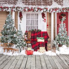 a christmas scene with presents on the porch