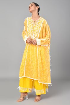 Mustard kaftan with floral printed motifs and bead embellishment. Comes with palazzo and inner.
Component: 3
Pattern: Embroidered and Print
Type Of Work: Floral Print, Beads and Thread
Neckline: Round
Sleeve Type: Flared
Fabric: Georgette, Cotton Silk and Organza
Color: Yellow
Other Details: 
Bead hangings
Palazzo with fringe hem
Keyhole front with tie up
Occasion: Sangeet - Aza Fashions Printed Kaftan, Bead Embellishment, Palazzo Set, Set For Women, Yellow Floral, Floral Printed, Cotton Silk, Aza Fashion, Fashion Set