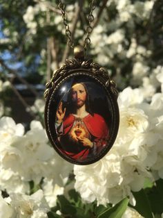 Beautiful pendant of Jesus Christ. The pendant is approx. 2,2 x1,6 inch (5,5 x 4 cm) and is set in a leadfree antique brass setting. The necklace is a very fine leadfree antique brass metal chain (length approx. 42cm). Due to the shape of the glass cabochon the light is reflected, so the real pendant is much more beautiful than the picture. The pendant is delivered in a nice gift pouch. Please feel free to follow me on Pinterest and instagram! Spiritual Medallion Necklace For Valentine's Day, Spiritual Large Pendant Necklace As Gift, Spiritual Medallion Necklace For Personalized Gift, Spiritual Necklace With Large Pendant For Gift, Oval Pendant Necklace For Valentine's Day Gift, Valentine's Day Medallion Jewelry Gift, Spiritual Heart Pendant Necklace For Gift, Spiritual Heart Pendant Necklace As Gift, Spiritual Oval Pendant Necklace For Gifts