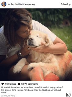 a woman holding a dog in her lap