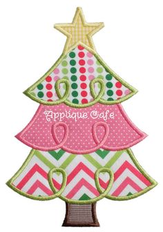 a christmas tree with a star on top and pink, green, yellow and white chevron