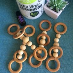 several wooden rings and beads next to a potted plant