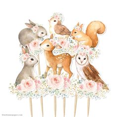 a bunch of animals that are sitting on top of a hair combs with flowers