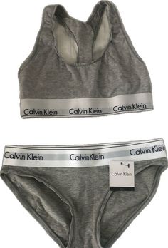 Sporty Cotton Sports Bra For Loungewear, Fitted Gray Cotton Activewear, Sporty Fitted Calvin Klein Bottoms, Calvin Klein Sporty Activewear For Gym, Calvin Klein Stretch Activewear For Yoga, Calvin Klein Fitted Sports Bra For Athleisure, Calvin Klein Fitted Athleisure Sports Bra, Calvin Klein Fitted Sports Bra, Calvin Klein Sporty Activewear With Medium Support