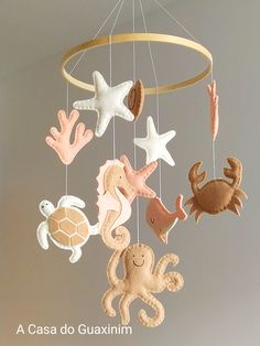 a mobile with sea animals and stars hanging from it