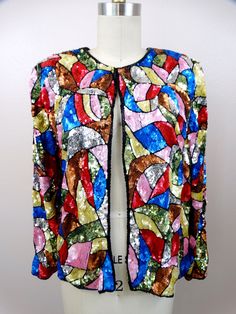 "This exquisite vintage piece, fully embellished with pink, red, blue, yellow, silver and gold sequins. There is one hook & eye closure at the top. It's in excellent condition! Bust - 36\" + Shoulder to Shoulder - 16\" Sleeve Length - 23\" Top to Bottom Length - 23\" Tag Size - Small (also fits medium) All of my items come from a smoke-free and pet-free home. I'm happy to answer any questions!" Sequin Jacket, Gold Sequins, Kimono Top, Jackets & Coats, Jackets For Women, Sleeve Length, Yellow Gold, Blazer, Yellow