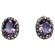 Pair of vintage European stunning amethyst drop earrings. Beautiful large oval amethyst surrounded with sparkling cubic zirconia, mounted in sterling silver marked 925, about 0.98 inch by 0.78 inch, weight about 13 grams. Vintage European, European Vintage, Sterling Earrings, Vintage Stil, Jewelry Earrings Dangle, Cubic Zirconia, Amethyst, Dangle Earrings, Jewelry Earrings