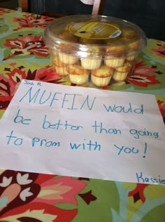 a sign on a table that says muffin would be better than going to prom with you