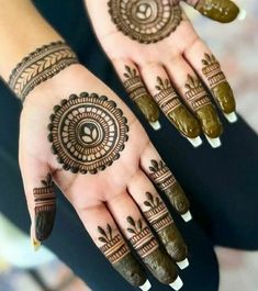 two hands with henna tattoos on them, one is green and the other is brown