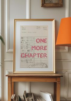 a table with books and a framed poster on it that says, one more charter