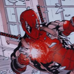 the deadpool character is holding a knife in his hand