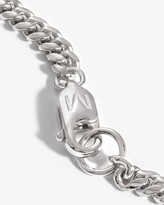 Round Curb Chain Bracelet. An Everyday Stacking Staple. Featuring a Soft Curb Chain and Rounded Edges, this Distinctive Bracelet is a Classic Addition to Your Arm Stack. Pair with a Chunky Chain to Create Contrast. Metal: Sterling Silver Dimensions: M - 190mm (No Extension), L - 210mm (No Extension) Chain Width: 4. 16mm Weight: 7. 56g Product Code: Mj-S-B2-Ns-M Modern Bracelet With Curb Chain And Oval Links, Sterling Silver Link Bracelet With Curb Chain For Everyday, Sterling Silver Curb Chain Bracelet For Everyday, White Gold Curb Chain Bracelet, White Gold Link Chain Bracelet, Everyday White Gold Chain Bracelet, White Gold Link Charm Bracelet With Jubilee Design, White Gold Jubilee Link Charm Bracelet, Silver Curb Chain Bracelet With Oval Link