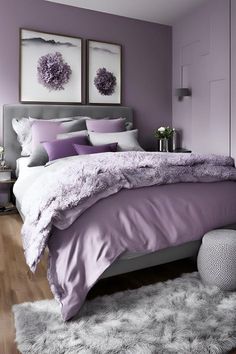 a bedroom with purple walls and white fur rugs