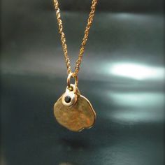 The Necklace And The Pendant Made From 14 Karats Solid Yellow Gold. Pendant Width 0.51inch/ 13mm. Chain Length 17.7inch/ 45 Cm'. 1 Black Diamond 0.02ct Hanging On A Small Pendant. Necklace For Women. Necklace For Men. Gold Handmade Necklace With Two Pendants. One Big, And On Small Bezel Set With Black Diamond. Delicate, And Timeless, A Gift That Each Woman Or Men Like To Have. Chain Available In All Sizes, Color Gold And Karat, And Matte Or Shining Finish. Yellow Gold Hammered Round Charm Necklace, Elegant Gold Hammered Charm Necklaces, Elegant Gold Hammered Charm Necklace, Round Hammered Fine Jewelry Necklaces, Fine Jewelry Hammered Necklaces For Anniversary, Elegant Hammered Yellow Gold Charm Necklaces, Hammered Fine Jewelry Necklace For Anniversary, 14k Stamped Yellow Gold Nugget Jewelry, Elegant Round Hammered Charm Necklaces