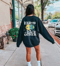 If you're the type of person who isn't afraid to fight for the planet, we might be best friends. Use this Be Kind To The Earth And Each Other aesthetic crewneck sweatshirt to spread some love and show off your trendy, vegan granola girl clothing vibe. If you're looking to gift the perfect nature lover, vintage vsco sweatshirt to gift friends, this one is it! We believe climate change awareness should be shouted from the rooftops and placed just about everywhere, from our heads to our toes and an Oversized Crew Neck Throwback Sweatshirt, Oversized Retro Crew Neck Hoodie, Vsco Style Crew Neck T-shirt For Streetwear, Retro Crew Sweatshirt With Screen Print, Vsco Streetwear Crew Neck Sweatshirt, Granola Outfits Summer, Crewneck Aesthetic, Trendy Crewneck Sweatshirt, Granola Outfits