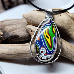 This Has So Many Bright Colors! This Fordite Came From The Kenworth Truck Factory. Normally I Form And Polish All Of My Fordite, But This Is The First One That I Purchased From A Seller. I Created The Sterling Silver Setting And Gave It A Darker Finish To Soften The Look Of The Silver. It Comes With A 20 Inch Leather Cord Necklace With A Sterling Silver Clasp. I Also Added A Picture Of What Fordite Looks Like When I Purchase It. What Is Fordite? It's Overspray From Painting The Trucks. When The Leather Cord Necklace, Kenworth Trucks, Leather Corded Necklace, Cord Necklace, Leather Cord, Bright Colors, Necklace Set, Silver Color, Womens Sizes