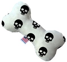 a bone shaped pillow with skulls on it