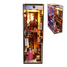 an open dollhouse with two dolls in it's display case and the door opened