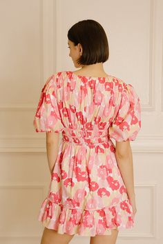 Step into your next special occasion in style with the Julia Pink Floral Mini Dress. This chic and vibrant dress is perfect for spring and summer events, featuring a flirty mini design with a multi-tonal pink floral print. It also has a deep V-neckline, short puffy sleeves, an empire-gathered cinched waist, and a ruffled hem. Show off your stylish look and feel confident in this timeless dress. Composition:Cotton Pink Floral Print V-neck Mini Dress, Multicolor Floral Print Mini Dress With Puff Sleeves, Summer Floral Print Mini Dress With Puff Sleeves, Flirty V-neck Floral Dress For Summer, Flirty V-neck Floral Summer Dress, Pink Floral Print Mini Dress For Summer, Pink Floral V-neck Summer Dress, Chic Pink Mini Floral Dress, Chic Pink Floral Mini Dress