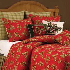 a bed covered in red and green christmas decorations