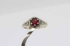 Vintage Sterling Silver Ruby Carved Filigree Ring....Marked 925...Total of weights 3.0grams... Size 7...Measure of Face 8.9MM...It's in very good condition. Classic Sterling Silver Ruby Ring, Classic Sterling Silver Round Ruby Ring, Sterling Silver Ruby Ring With Diamond Cut, Classic Engraved Round Ruby Ring, Classic Round Ruby Ring In Sterling Silver, Classic Silver Ruby Ring For Anniversary, Classic Hallmarked Sterling Silver Ruby Ring, Classic Engraved Ruby Ring, Classic Silver Ruby Ring With Diamond Cut