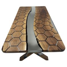 a wooden table with metal legs and an interesting design