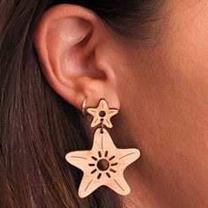 Introducing Wild Cloud "Moana" Starfish Bamboo Earrings This new arrival to our Dreamy Coastal Collection is inspired by the Hawaiian word for ocean, “Moana”. These earrings are made from sustainable bamboo and set on hypoallergenic titanium studs. The charming starfish design symbolizes healing and renewal. They're light enough for all-day wear and will complement any outfit. Eco-friendly Bamboo Hypoallergenic Titanium Studs Made in USA A Tree Planted for Every Pair Sold Ocean Moana, Pineapple Christmas, Starfish Design, Abalone Ring, Music Ornaments, Ukulele Accessories, Kukui Nut, Abalone Earrings, Hawaiian Quilts