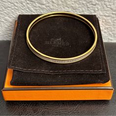 Herms Uni Bangle Marron Glac Size 65 Includes Dustbag, Box And Tag Card Extra-Narrow Bangle In Enamel. Metallic Finish: Rose Gold Plated Interior Diameter: 2.48" | Width: 0.22" Reasonably Priced Or Offer Me Your Best Price Please Be Respectful And Be Considerate Of Your Offer. All Earned Profit Will Help Me Pay For School Since I’m A Full-Time Nursing Student. All Sales Will Be Shipped The Next Day At 4:00pm (Pst) Except Sundays Luxury Gold-tone Logo Plaque Bracelet, Designer Gold-tone Logo Bracelets As Gift, Hermes Jewelry, Nursing Student, Affordable Jewelry, Nursing Students, Full Time, Rose Gold Plates, Gold Plate