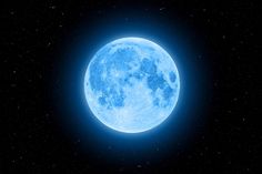 a blue moon is shown in the dark sky