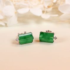 The GRANSKY x KATHERINE jadeite stud earrings harmonizes the bold lines of contemporary design with the captivating essence of imperial green jade.  Crafted in 18K white gold, this delicate stud earrings feature a rectangular jadeite stone that exude a vivid, translucent green hue - a testament to the gemstone's natural beauty and unparalleled quality. The earrings' unique design artfully blends the classic elegance of jade with a modern, architectural sensibility that echoes the visionary desig Cleansing Stones, Burmese Jade, White Gold Earring, Jade Earrings, Good Marriage, Jade Ring, Peach Blossoms, White Gold Earrings, Earrings Unique