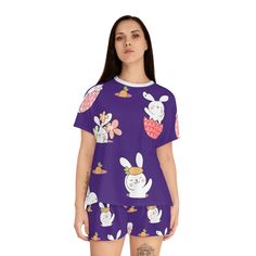 This cute and comfortable pajama set is the perfect way to celebrate Easter! The soft cotton fabric is printed with a fun bunny print, and the set includes a short sleeved top and matching shorts. The top features a scoop neckline and a boxy fit for a relaxed, comfy fit. This adorable pajama set is perfect for lounging around the house or snuggling up and falling asleep! Why pick between comfort or style when you can have both? These women's short pajama two-piece set come with a relaxed fit, a Cute Printed Sleepwear For Pajama Party, Cute Printed Loungewear Sets, Spring Cartoon Print Sleepwear For Bedtime, Cute Printed Sleepwear, Cute Crew Neck Sleepwear For Pajama Party, Cute Crew Neck Sleepwear For Sleepovers, Cute Relaxed Fit Pajama Shorts, Loungewear Sets With Cartoon Print And Crew Neck, Cute Spring Graphic Print Sleepwear